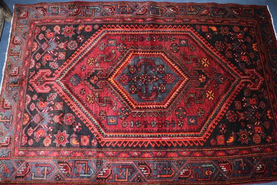 A Hamadan red ground rug, 6ft 5in by 4ft 3in.